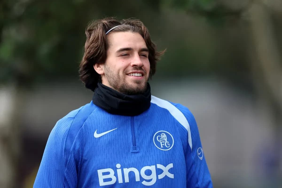 Player smiling during training session in blue kit