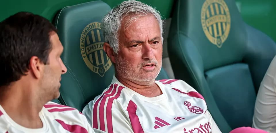 Manager discussing strategy on team bench