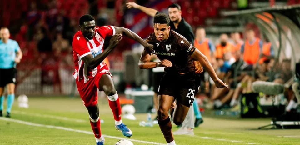 Players competing for the ball during match