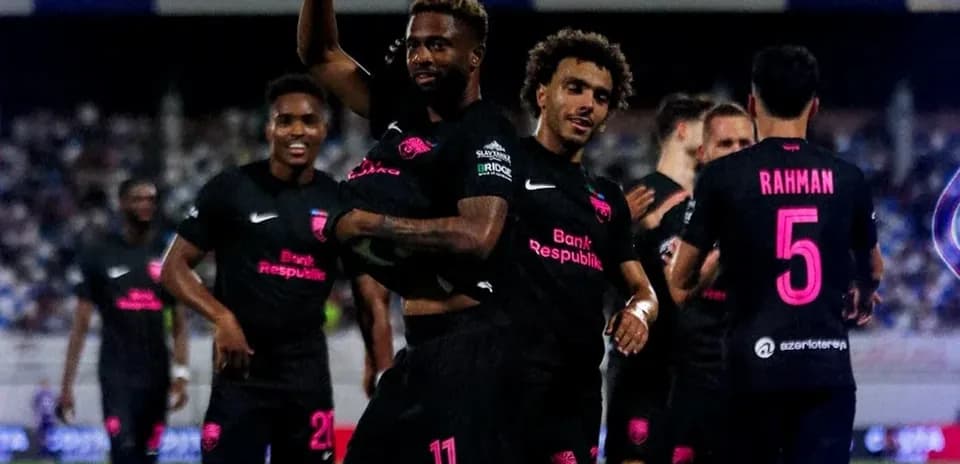 Players celebrating a goal during football match
