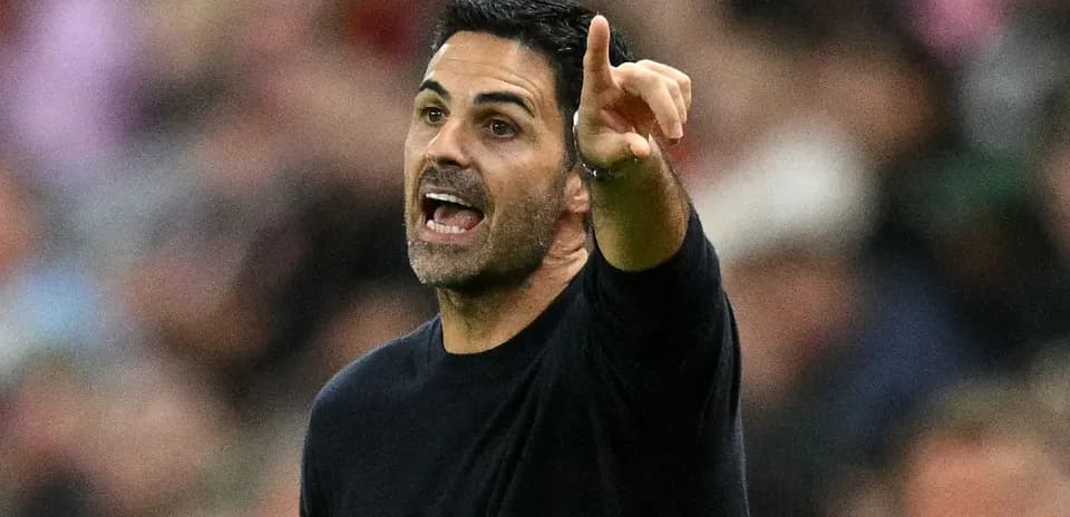 Manager gesturing and speaking during match
