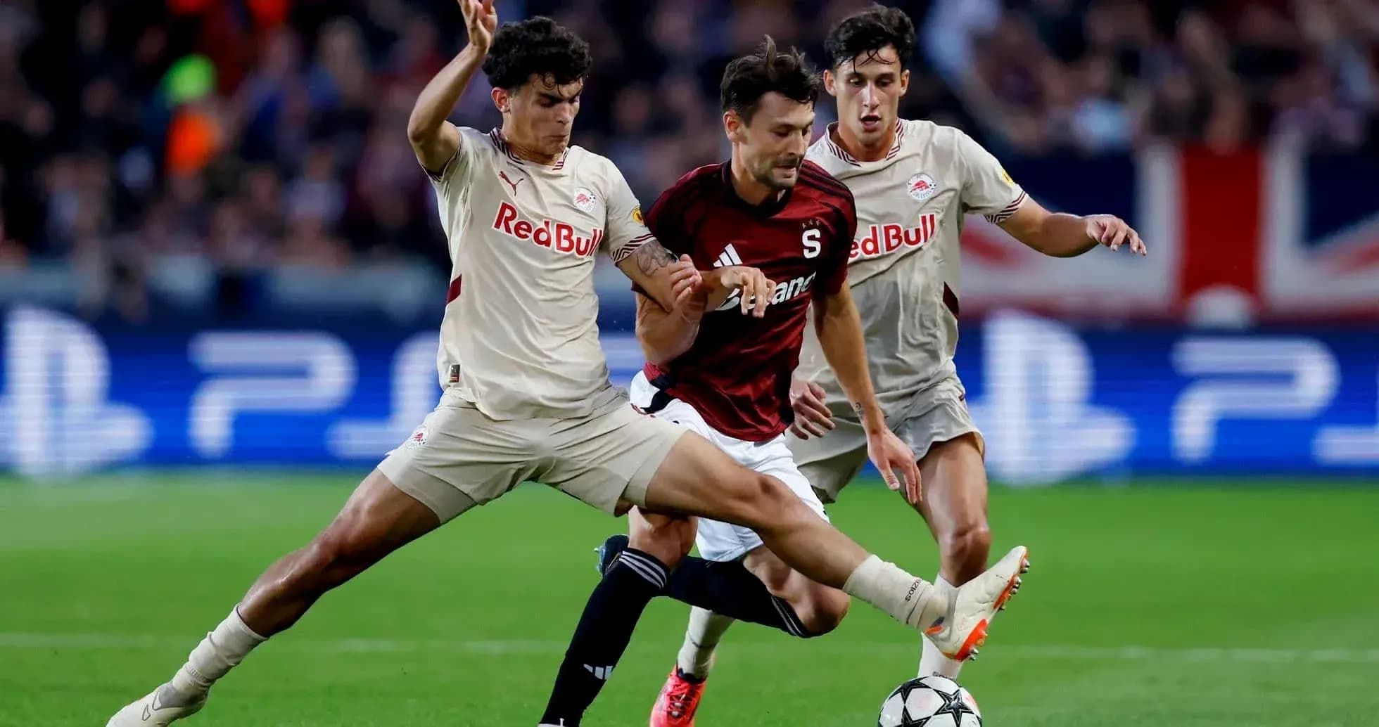 Players competing for the ball in Europa League match