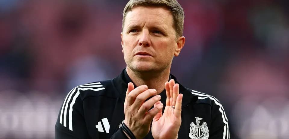 Manager applauding during match at stadium