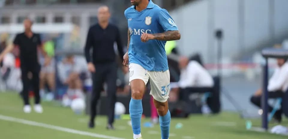 Player in blue kit running with the ball