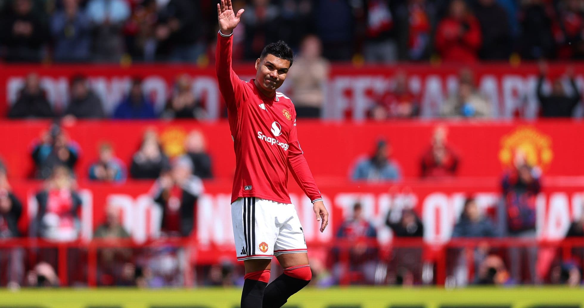 Player waving to fans at stadium