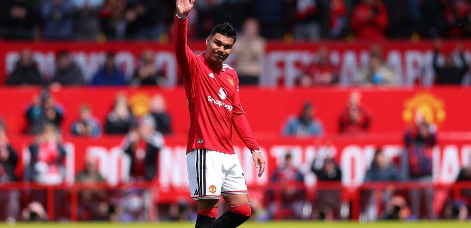 Player waving to fans at stadium