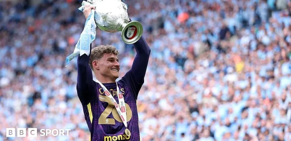 Player celebrating with trophy after winning match