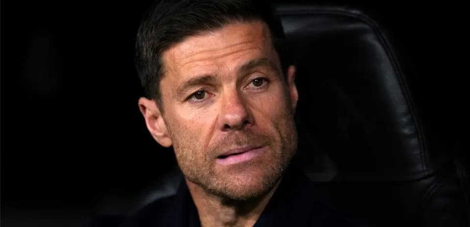 Coach sitting on bench during match
