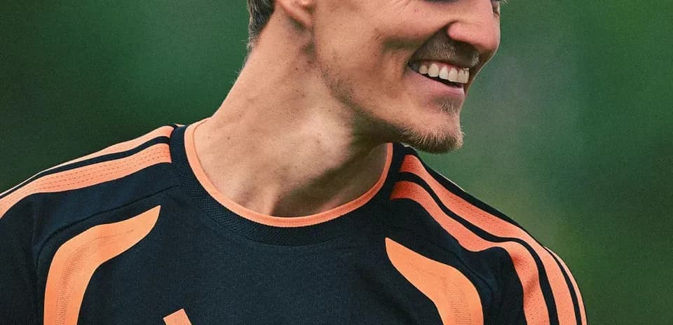 Player smiling in training kit during session