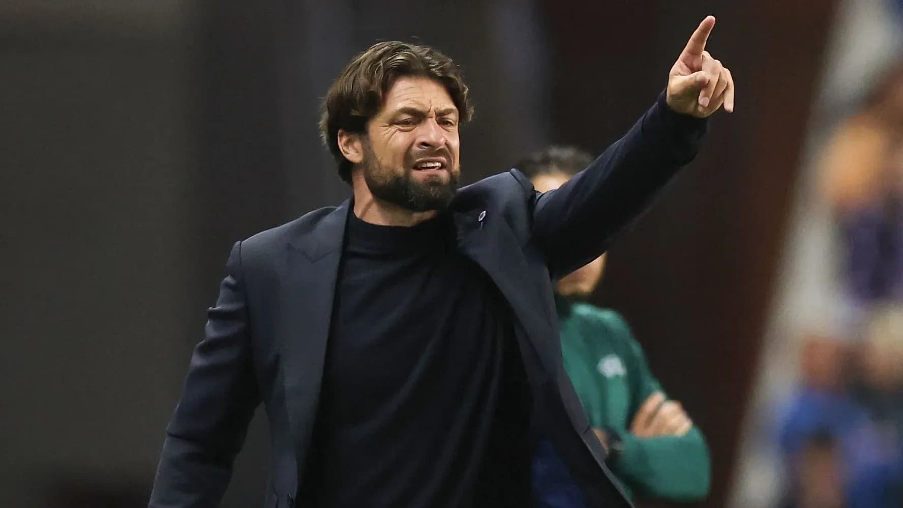Coach giving instructions during a match