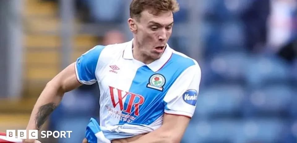 Player pulling at his shirt during match action