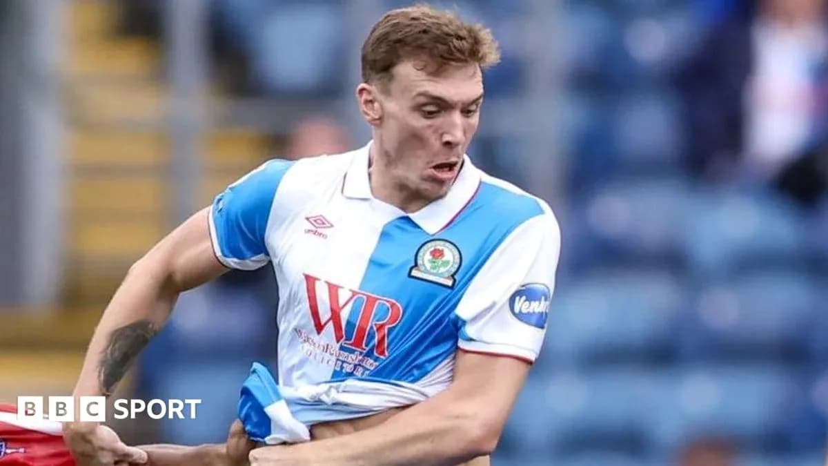Player pulling at his shirt during match action