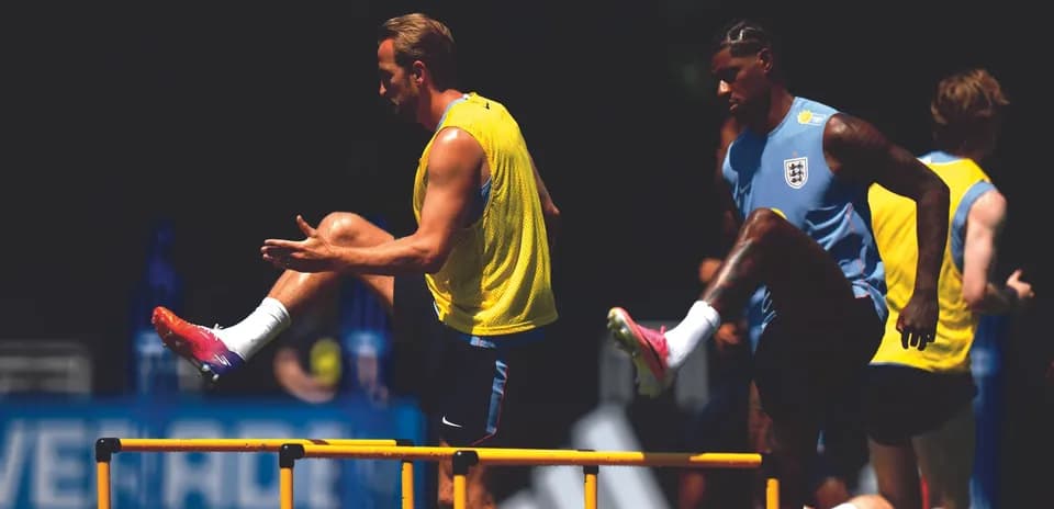 Players training with hurdles during a practice session