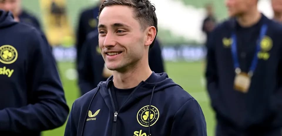 Player smiling during pre-match warm-up session