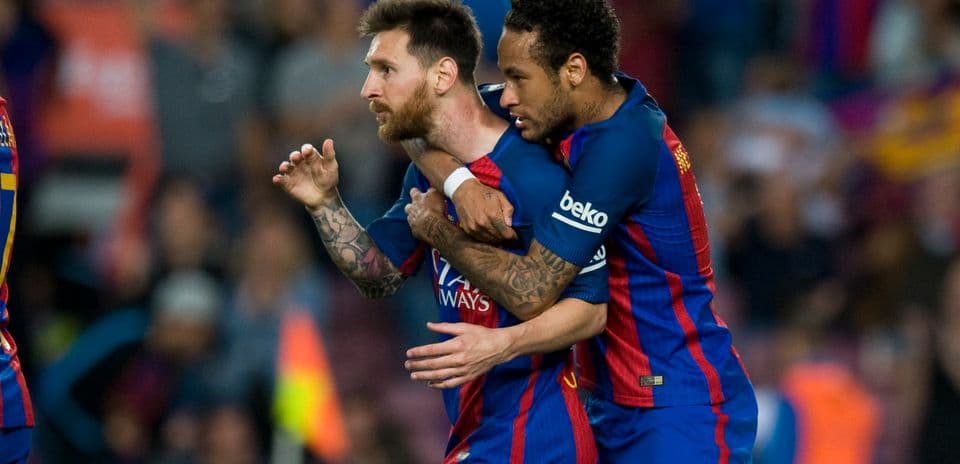 Lionel Messi celebrating with Neymar during match