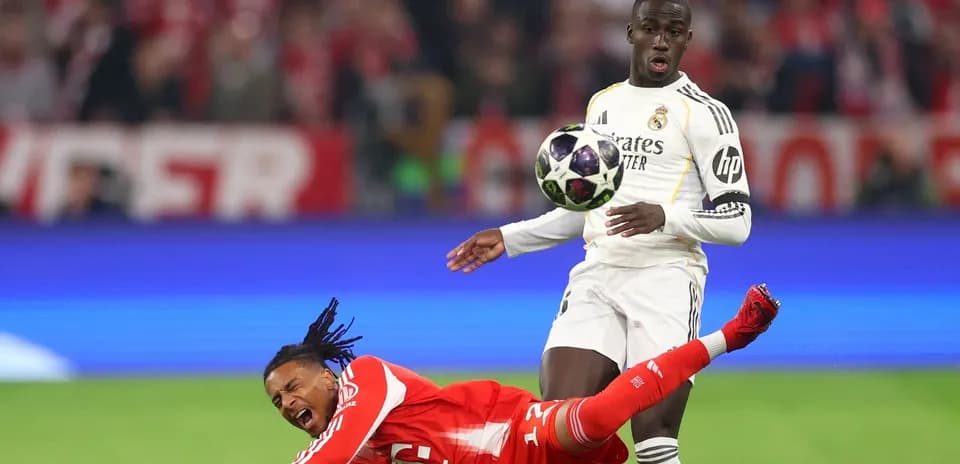 Player falling as opponent attempts to control ball