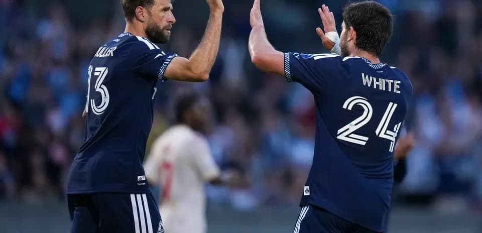 Players celebrating during Vancouver FC match