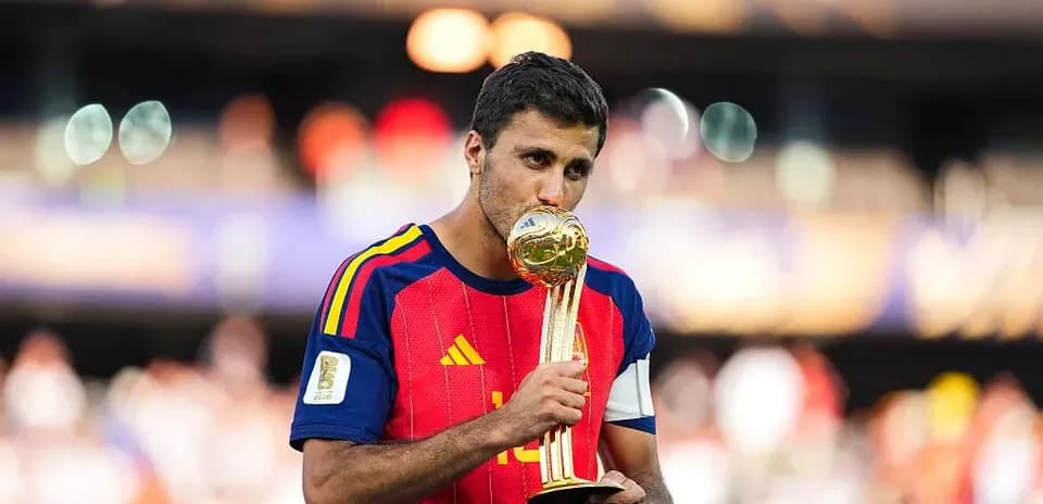 Player kissing the World Cup trophy on field