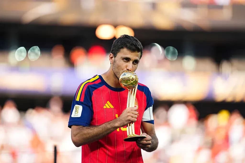 Player kissing the World Cup trophy on field