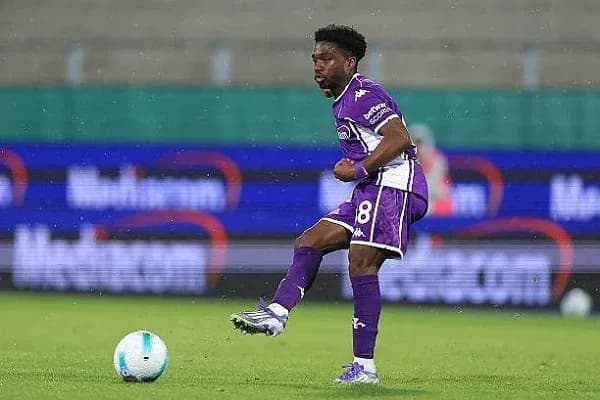 Player dribbling the ball during match action