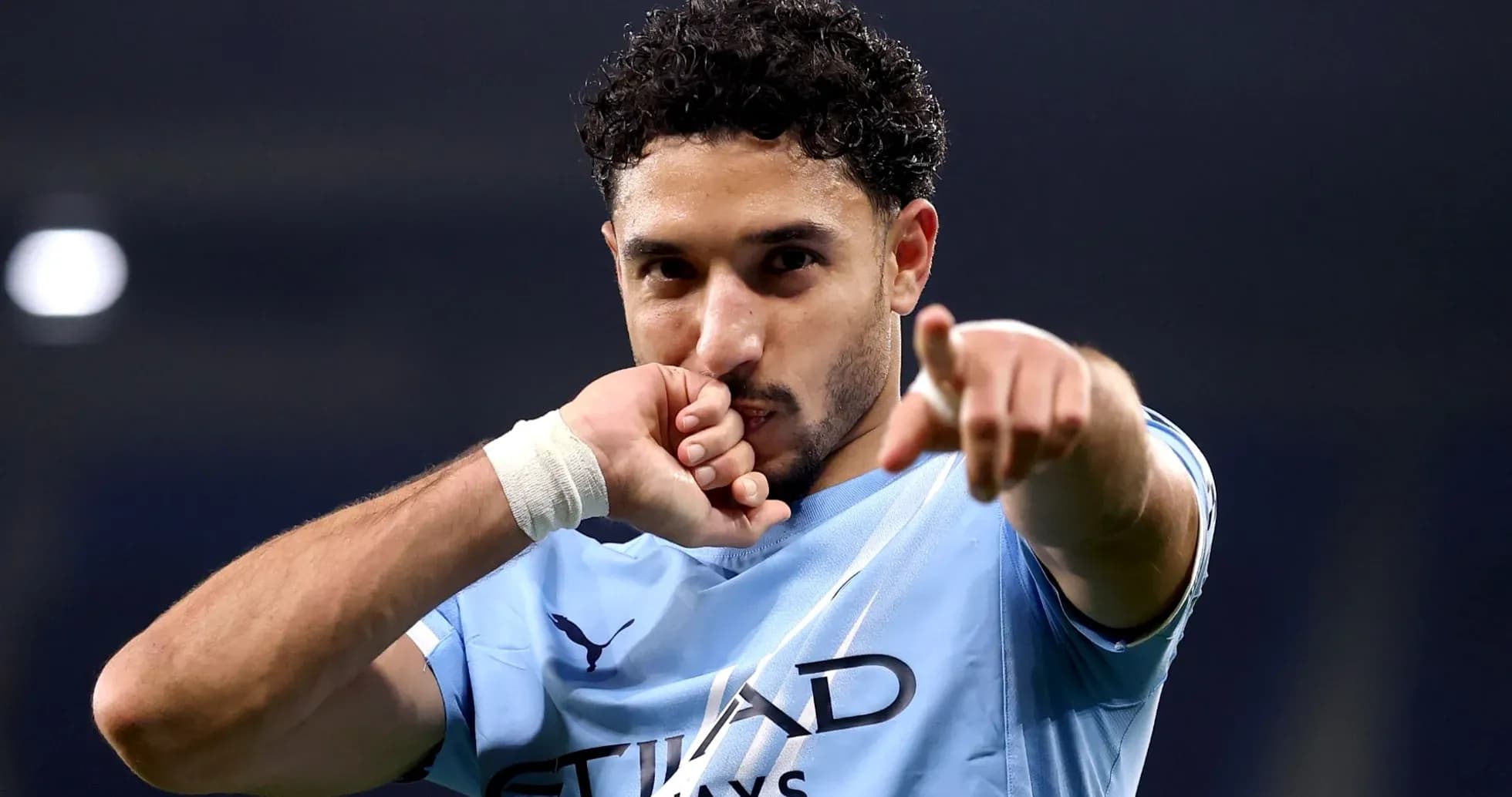 Player celebrating and pointing after scoring a goal