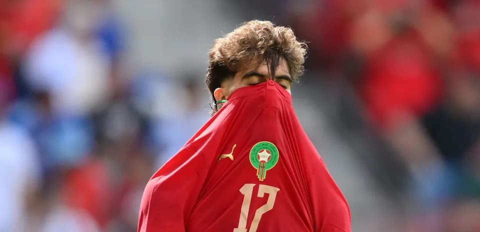 Player pulling jersey over face during match