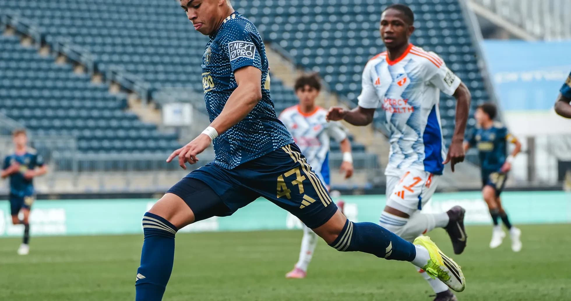 Player kicking the ball during Union II match