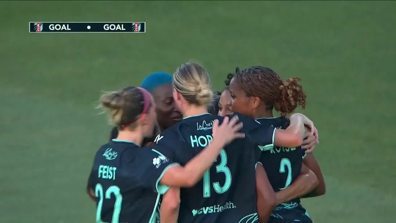 Players celebrating a goal during match