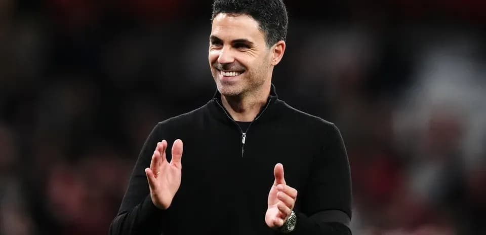 Manager applauding during a match on the sidelines