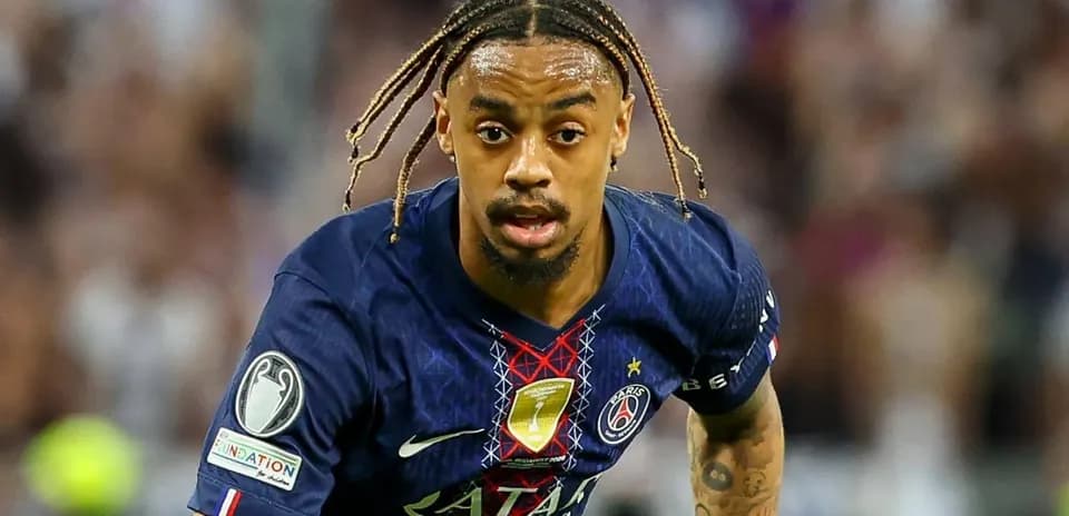 Player in Paris Saint-Germain kit running on field