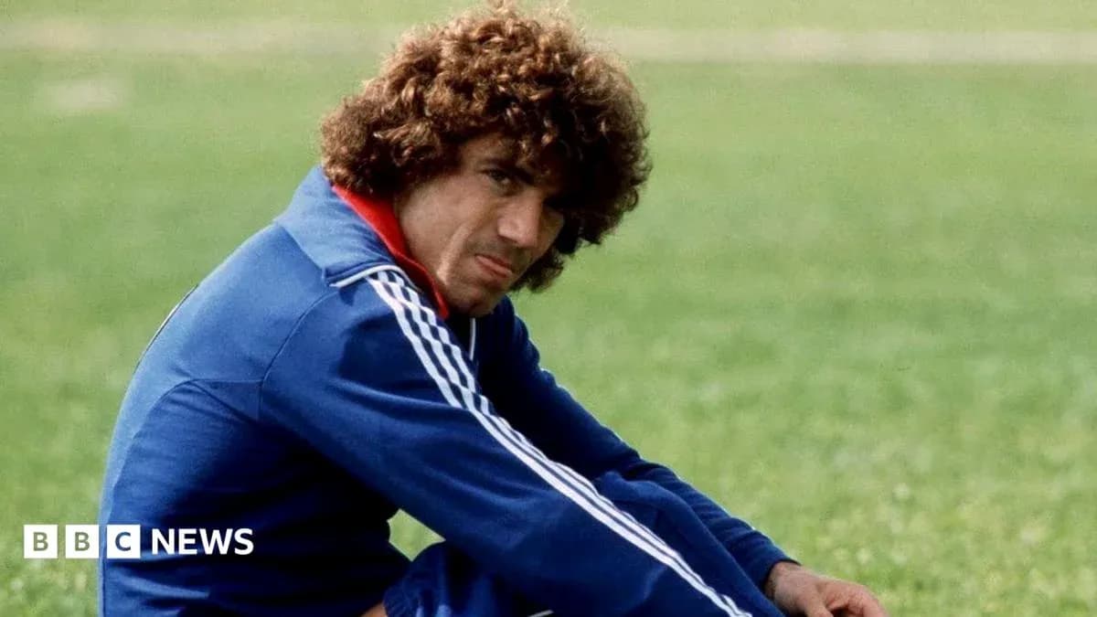 Player sitting on grass field in training gear