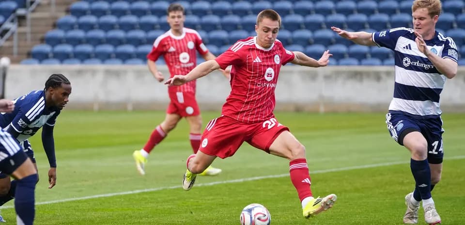 Players competing for the ball in MLS Next Pro