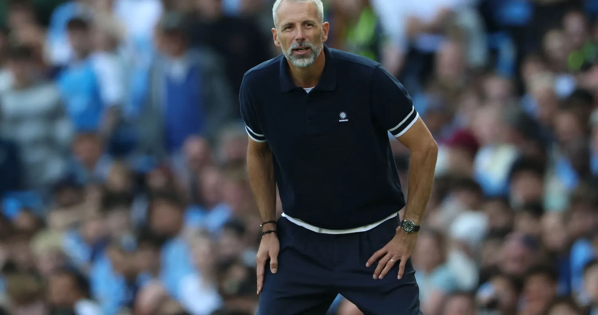 Coach observing the match from the sideline