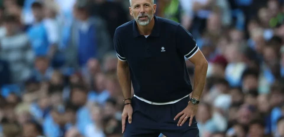 Coach observing the match from the sideline