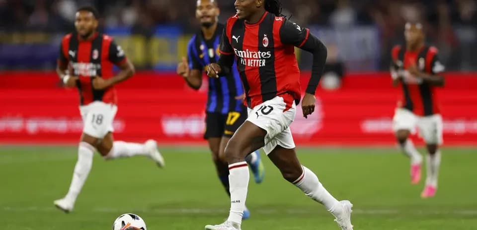 AC Milan player dribbling ball during match