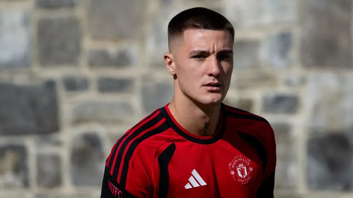 Player in Manchester United training kit outdoors