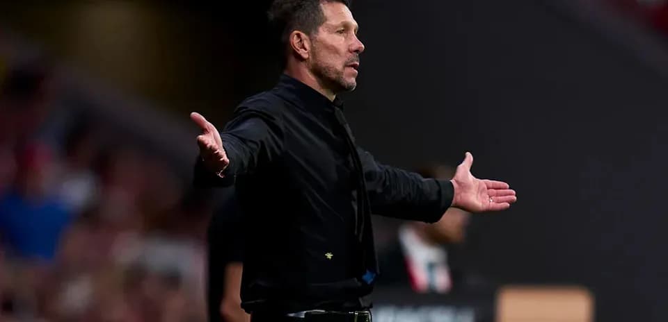 Manager gesturing during match from the sidelines