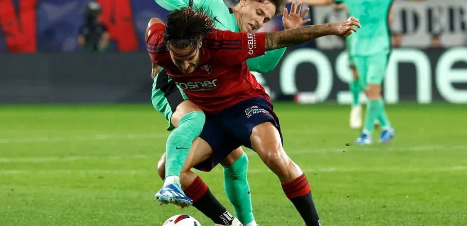 Players contesting for the ball in La Liga match