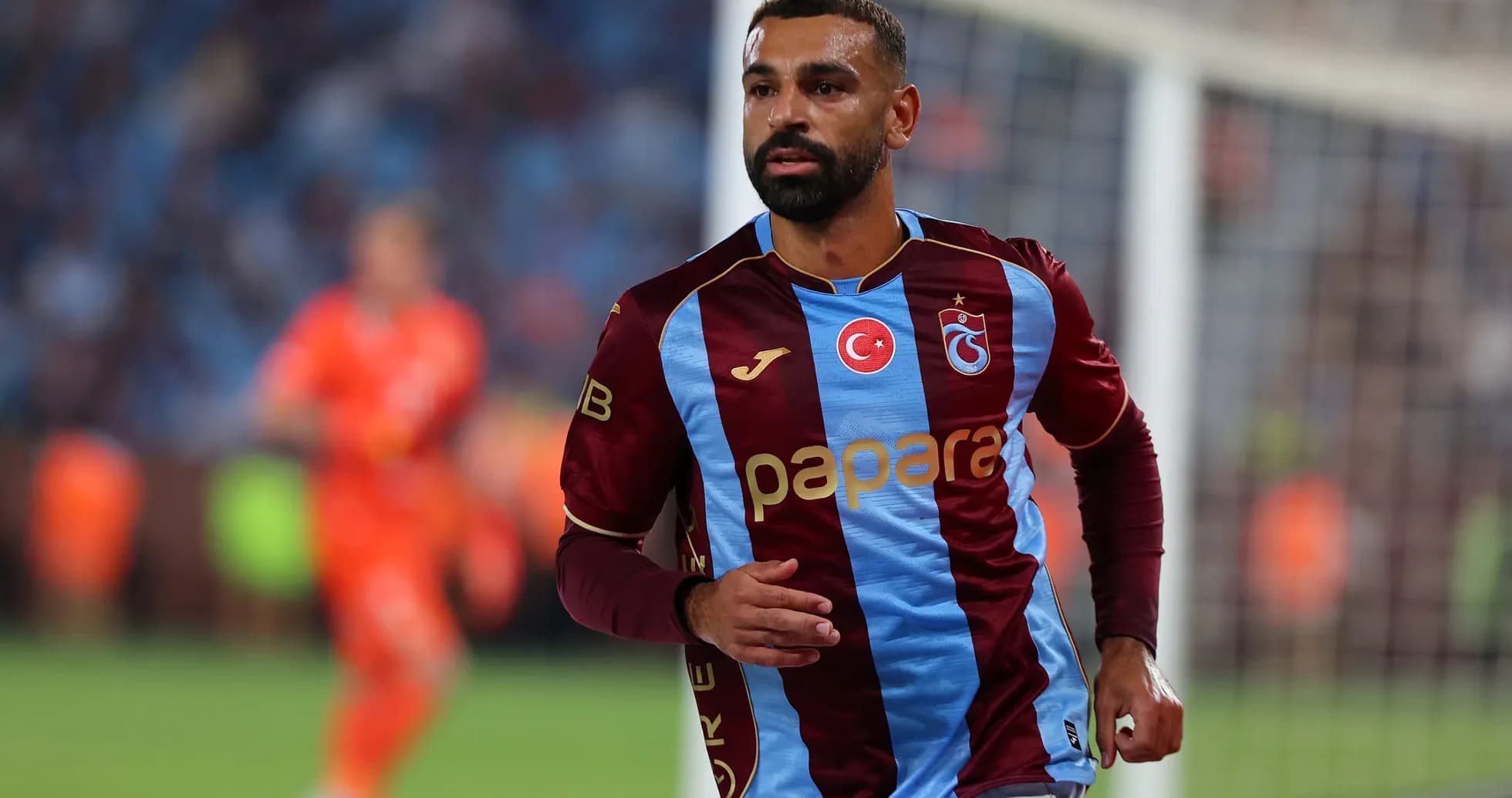 Trabzonspor player running during UEFA match