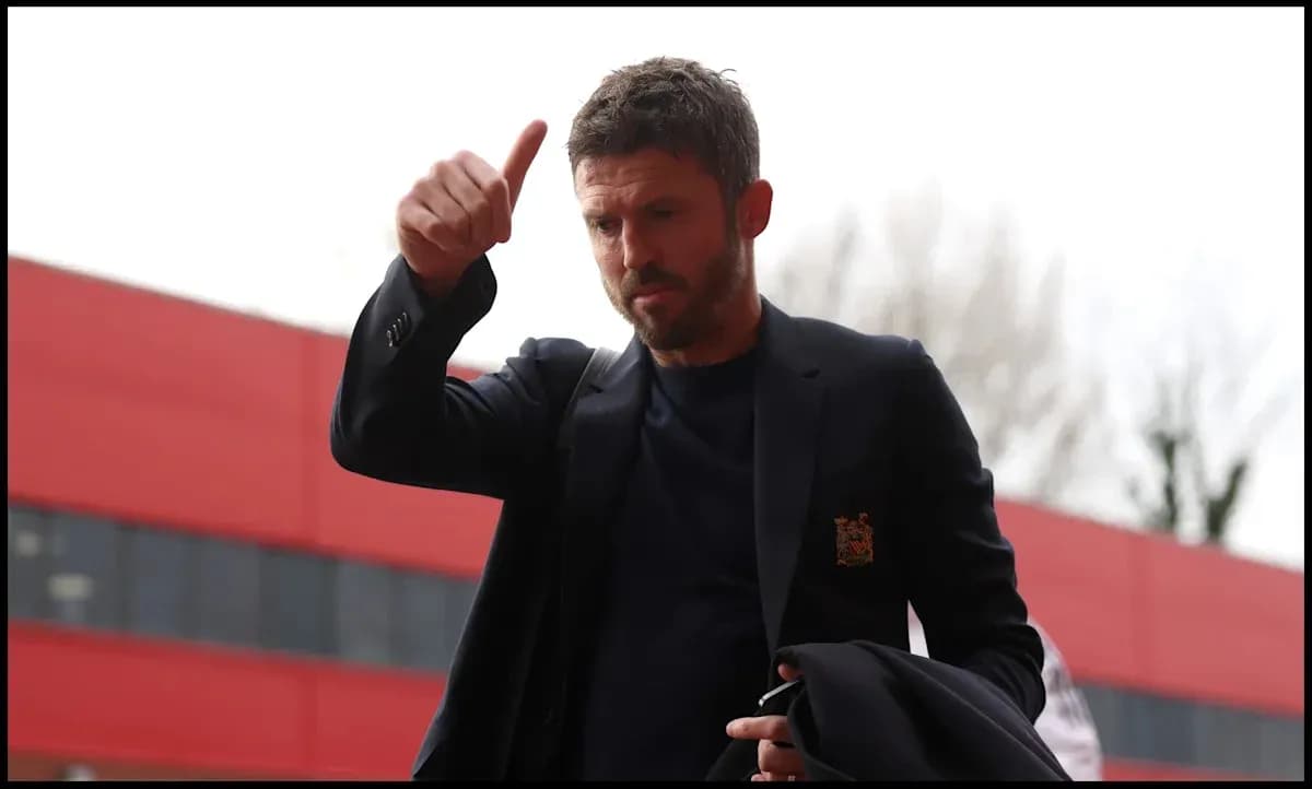 Man giving a thumbs-up outside stadium entrance
