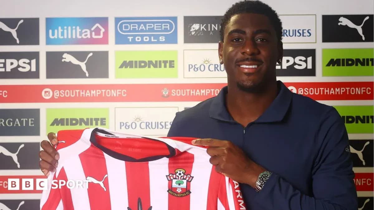 Player holding Southampton FC jersey during signing event