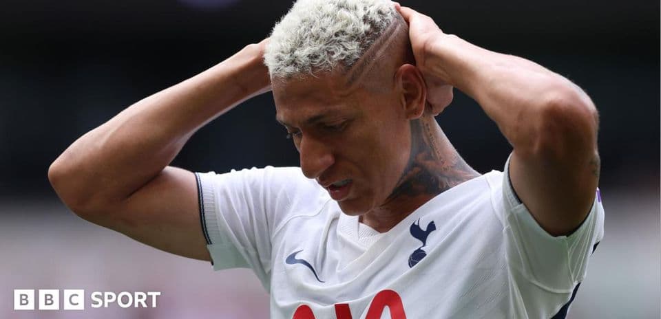 Player holding head in distress on the pitch