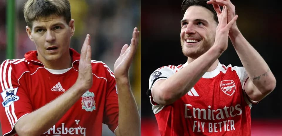 Two football players applauding fans after match