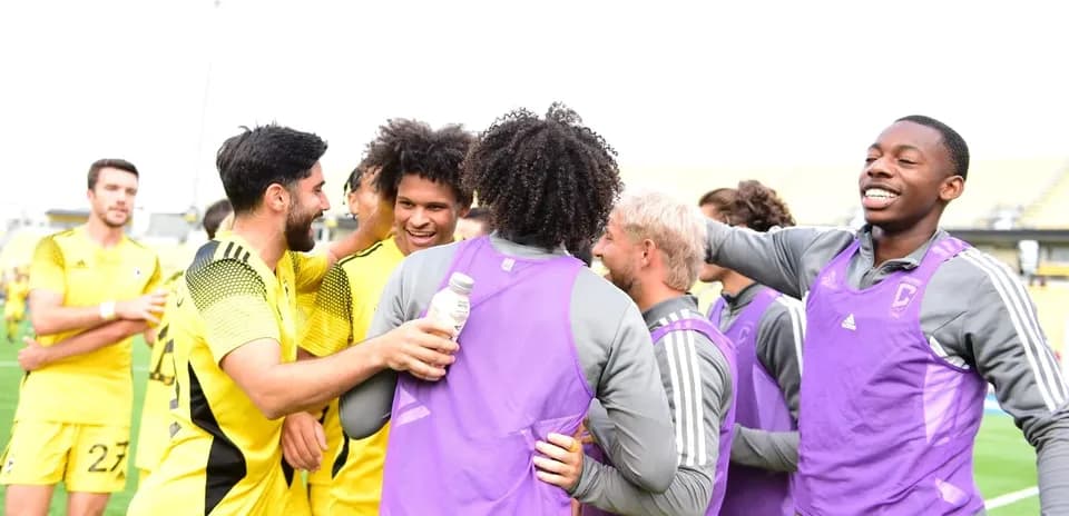 Players celebrating during Columbus Crew II match