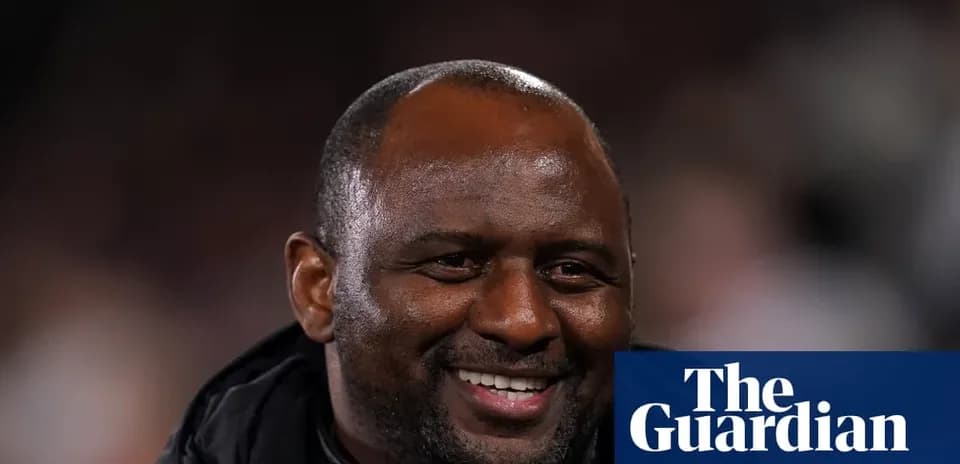 Man smiling during a football match event