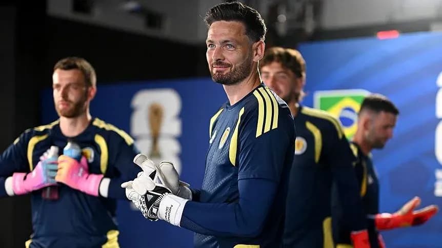 Goalkeeper and teammates preparing for match backstage