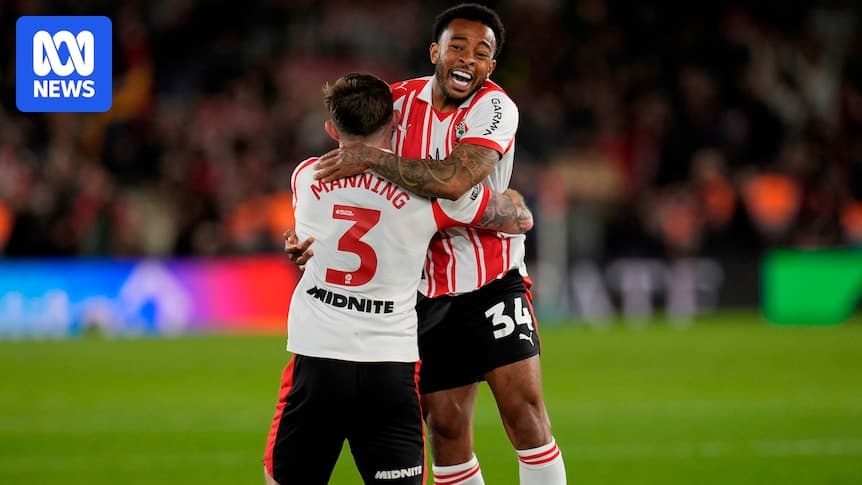 Two players celebrating together on the field