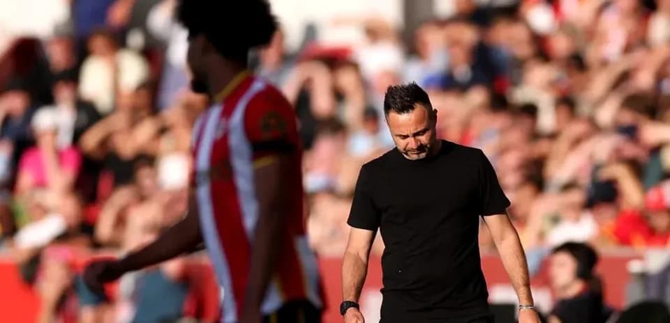 Manager walking off the pitch during match