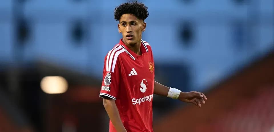 Young player wearing Manchester United jersey on field