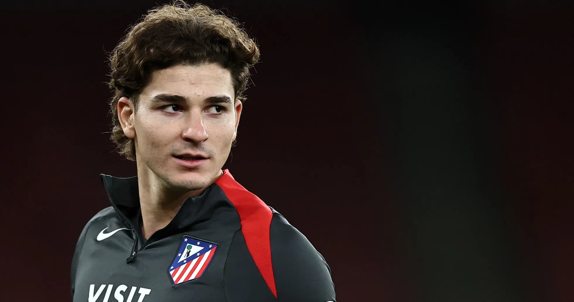 Player wearing Atletico Madrid training gear looking sideways